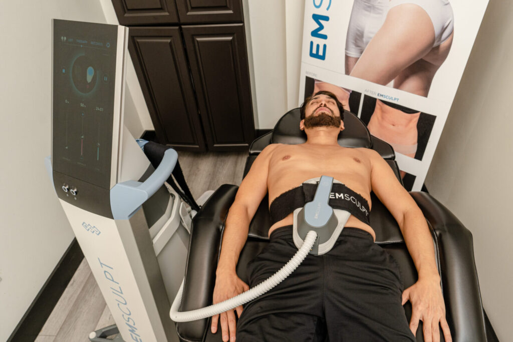 Male model undergoing for Emsculpt NEO treatment at Wellnessesity in New Jersey.