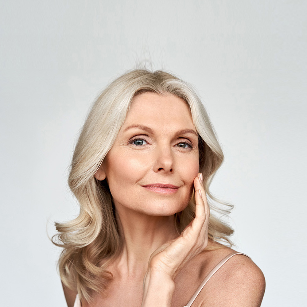 Older woman showing her radiant glowing skin