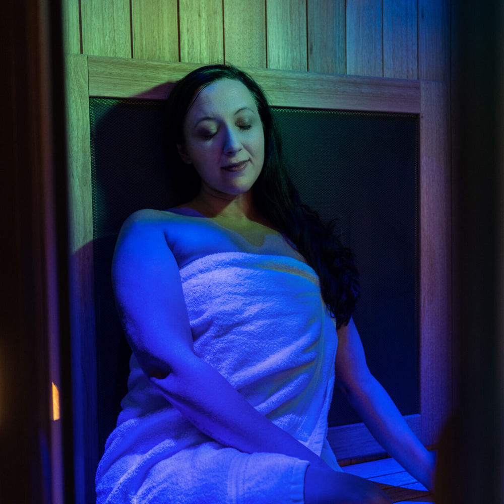 Female in white towel ready for Infrared Sauna