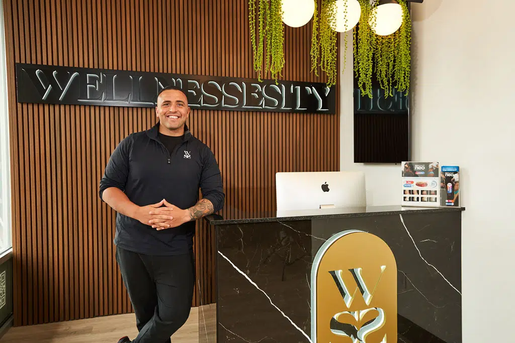 Am image showing health and wellness expert Billy Atkinson standing in the front desk.